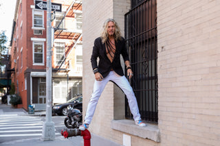 image man standing on window ledge