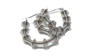 PRODUCT FEATURES:  316L High-Grade Stainless Steel  Hoop Length 1.5 Inches Hoop Opening 1 Inch Bamboo Width: 3mm Weight: 2 grams Water-Resistant Tarnish-Free  *Extremely Lightweight.  Designer's Notes: Be bold and stylish with our Lightweight Slinky Design Earrings and wear them every day or for any occasion!