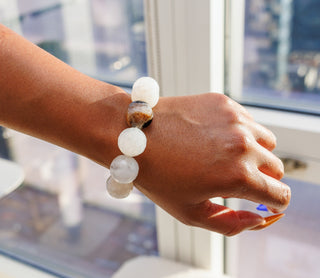 Black woman wearing Luxury Faceted White Botswana Agate Natural Gemstone Bracelet
