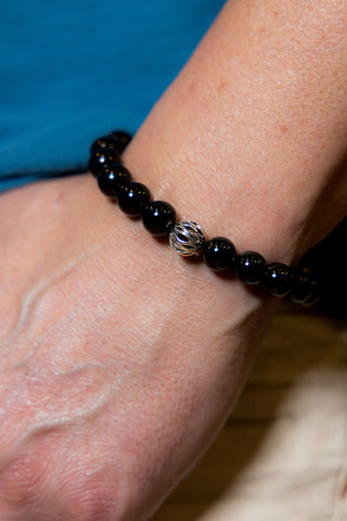 Man wearing Onyx Abacus Gemstone Bracelet.