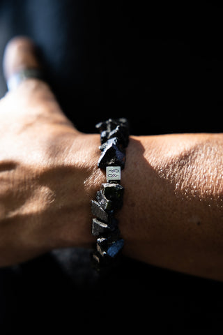 Alt= Male wearing Raw Black Tourmaline Natural Gemstone Braccelet.