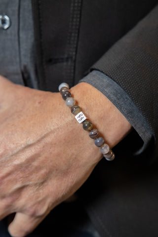 Man Wearing Botswana Agate beaded bracelet.
