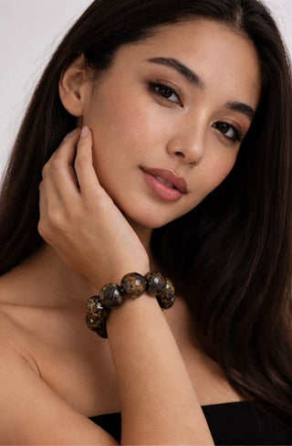 Asian woman wearing Luxury Faceted Bronzite Natural Gemstone Bracelet
