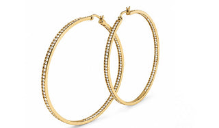 Gold hoop earrings with embedded stones on a white background The Eva Crystal Hoop Earrings