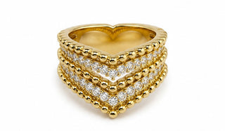 Gold heart-shaped ring with diamond accents on a white background