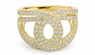 Gold ring with diamond accents on a white background
