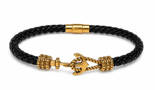 Black braided leather bracelet with gold anchor charm on a white background Leather Anchor Bracelet Gold