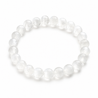 A beaded stretch bracelet made of clear, round glass beads with fine internal textures, arranged in a circle on a plain white background.