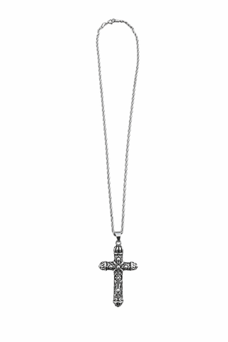 Silver cross necklace on a white background