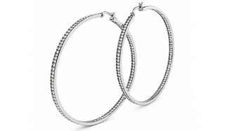 Silver hoop earrings with embedded stones on a white background