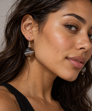 Woman wearing faceted botswana earrings