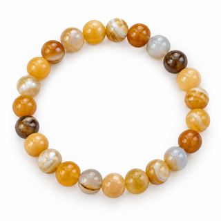 A beaded stretch bracelet made of polished round gemstone beads in warm orange, amber, brown, cream, and light gray tones, arranged in a circle on a white background.
