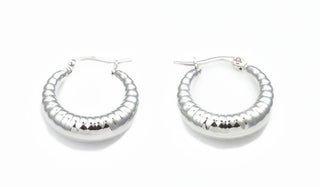 Silver PRODUCT FEATURES:  316L High-Grade Stainless Steel&nbsp; Water-Resistant Tarnish-Free .1'' Length .1'' Wide 3mm Depth  Designer's Notes: Be bold and stylish with our Chunky Ribbed Hoop Earrings and wear them for any occasion!  *Please Note No two pairs are EVER alike and your handmade, Stainless Steel Earrings will have small variations from the image