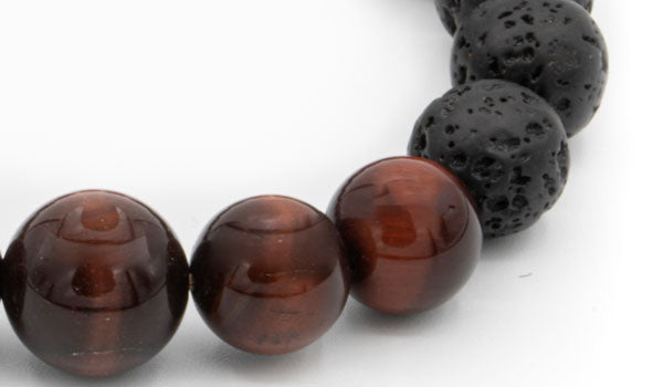 Black lava and red tigers eye natural stone bracelet close up