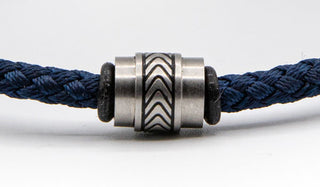 Stainless Steel Charm on Blue Cord bracelet.