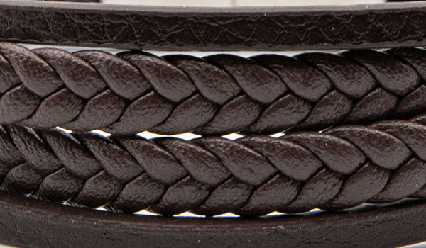 Alt=Brown leather layered bracelet close up.