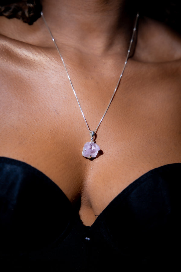 Woman wearing Pink Kyanite Crystal Necklace.