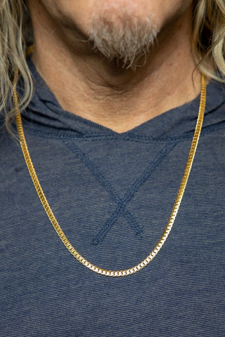 Man wearing Gold Herringbone Chain.