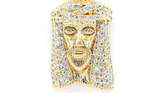 Gold Jesus pendant close up