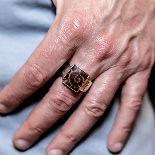 Mann wearing Sterling Silver Ammonite Ring.