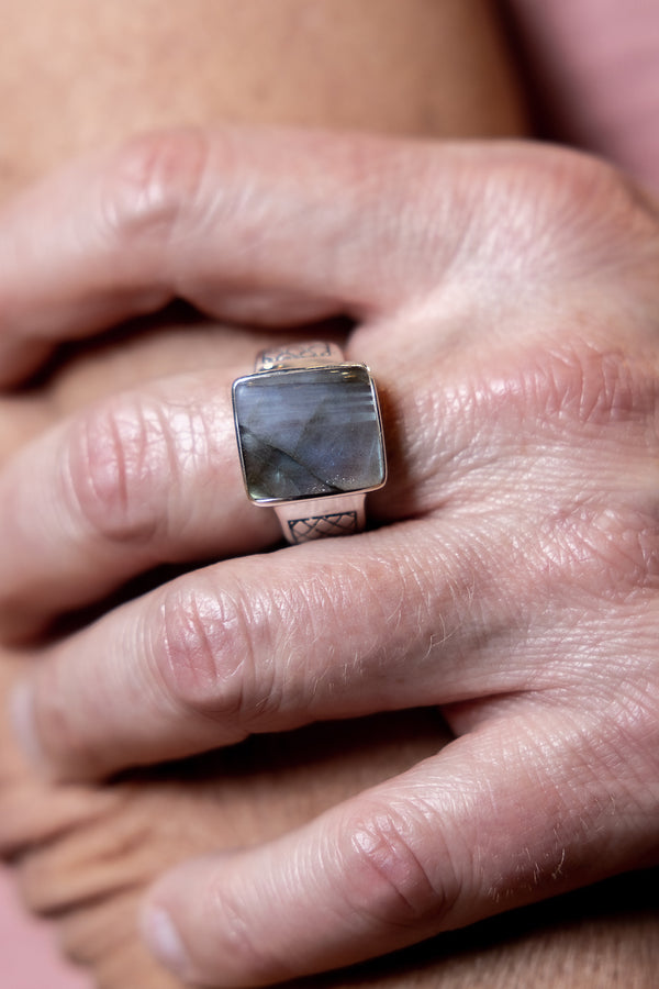 Man wearing Labradorite Ring.
