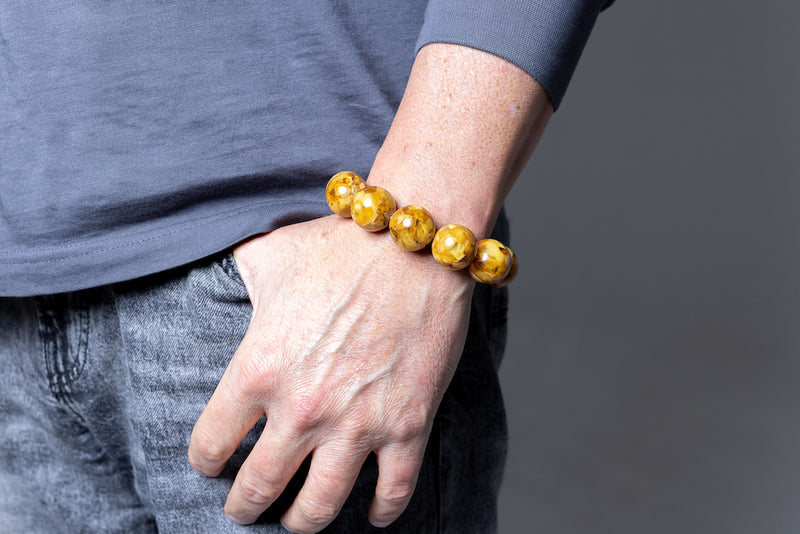 Man wearing Luxury Milky Butterscotch Baltic Amber Bracelet