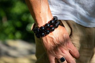Alt= Male wearing two smoky quartz bracelets