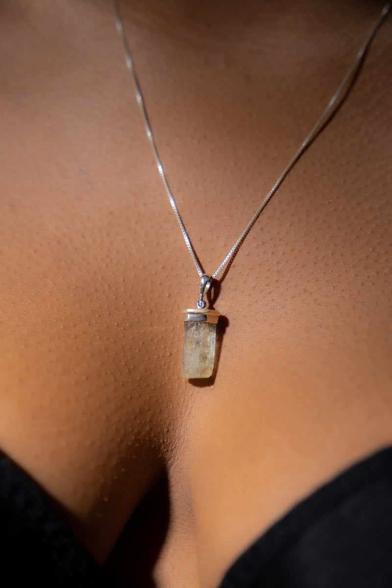 Hiddenite Gemstone Necklace on Woman.