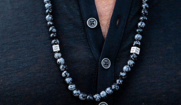 Alt= Male wearing Snowflake Obsidian Gemstone Necklace